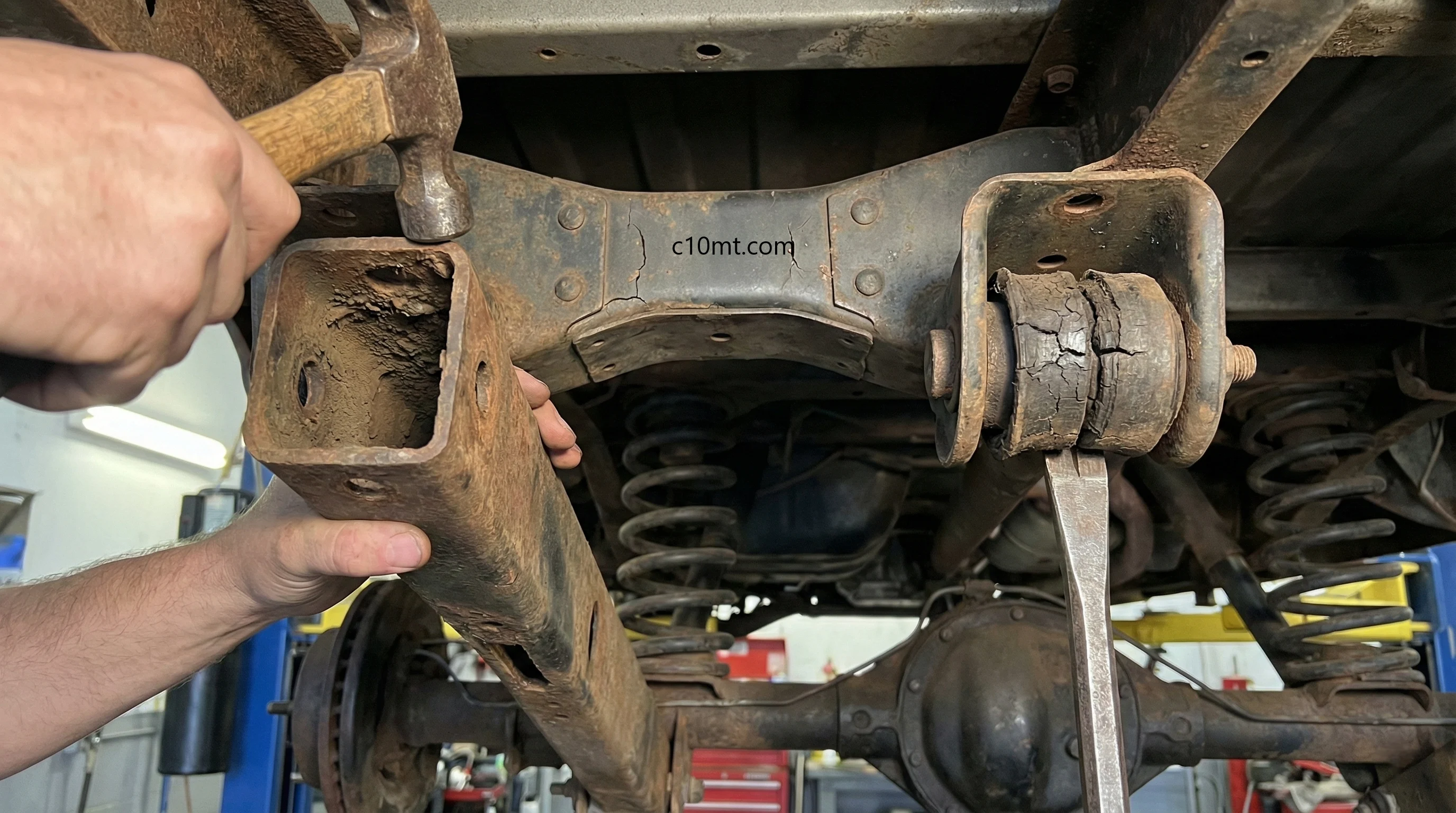 Technical inspection of Chevy C10 trailing arm suspension, bushing wear and crossmember stress cracks